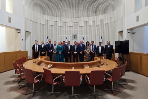 group of delegates standing in conference room